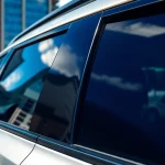 Discover the best window tint Chattanooga TN on a sleek vehicle highlighted against an urban backdrop.