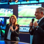 Engaging discussion in sports broadcasting studio featuring lively presenters.