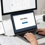 Download WPS Office on a sleek laptop in a modern workspace with productivity tools.